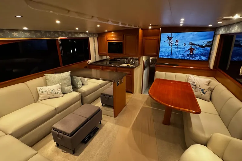 Hammertime Yacht Photos Pics Luxurious interior of 2002 Cavileer 48 Flybridge Sportfish yacht with plush seating and modern amenities.