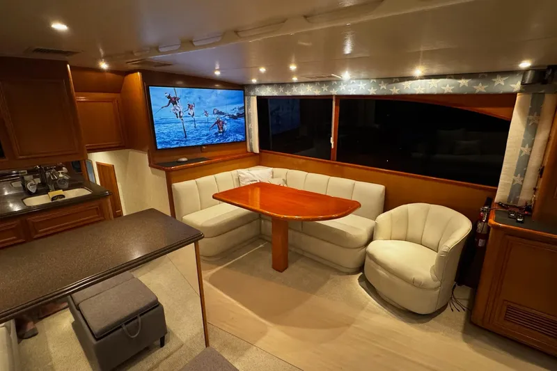 Hammertime Yacht Photos Pics Luxurious interior of 2002 Cavileer 48 Flybridge Sportfish with cozy seating and modern amenities.