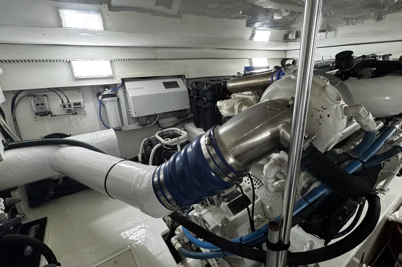 Hammertime Yacht Photos Pics Engine room of 2002 Cavileer 48 Flybridge Sportfish with visible machinery and components.