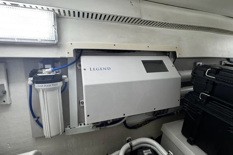 Hammertime Yacht Photos Pics Engine room of 2002 Cavileer 48 Flybridge Sportfish with water filtration system.