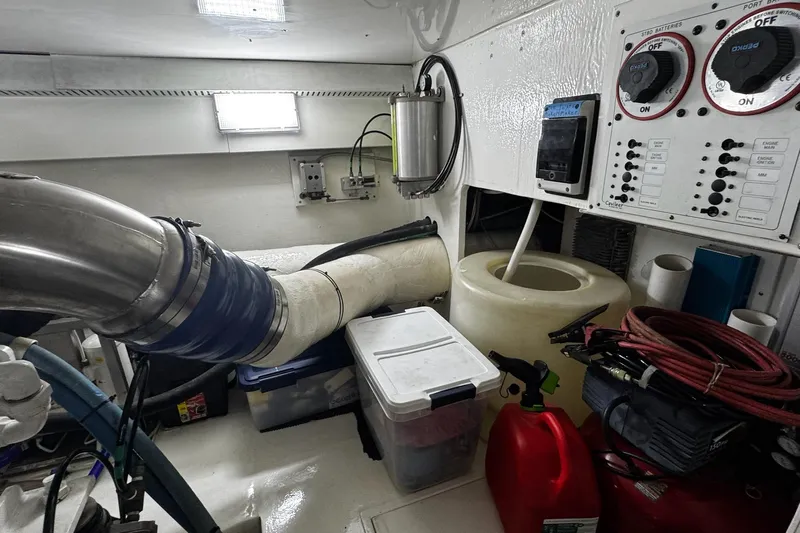 Hammertime Yacht Photos Pics Engine room of 2002 Cavileer 48 Flybridge Sportfish with control panels and equipment.