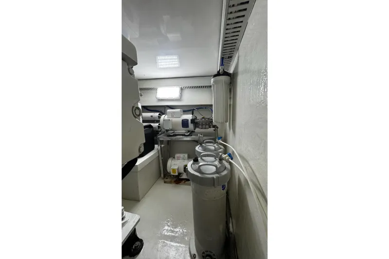 Hammertime Yacht Photos Pics Engine room of 2002 Cavileer 48 Flybridge Sportfish with filtration system and equipment.