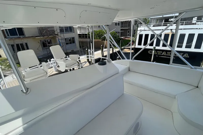 Hammertime Yacht Photos Pics 2002 Cavileer 48 Flybridge Sportfish interior with white seating and helm chairs.