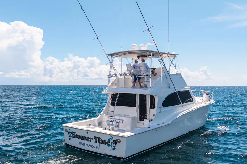 Hammertime Yacht Photos Pics 2002 Cavileer 48 Flybridge Sportfish yacht cruising on open ocean under clear skies.