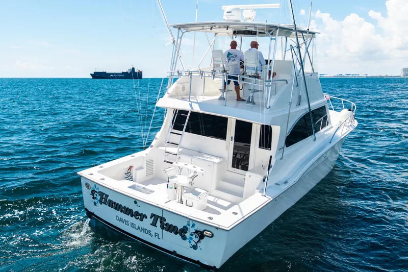 Hammertime Yacht Photos Pics 2002 Cavileer 48 Flybridge Sportfish yacht cruising on open water.