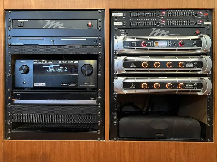 Chasing Waterfalls Yacht Photos Pics Audio equipment setup on a Tayana Isara 50 yacht, featuring amplifiers and media player.