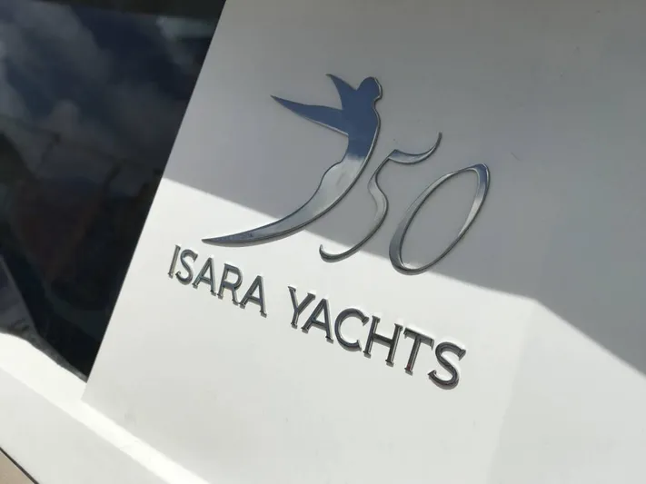 Chasing Waterfalls Yacht Photos Pics Tayana Isara 50 yacht logo on white surface, 2014 model.