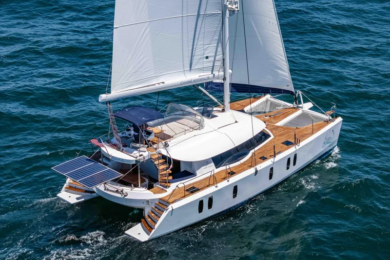 Chasing Waterfalls Yacht Photos Pics Sailing catamaran Tayana Isara 50, 2014 model, cruising on open sea with solar panels.