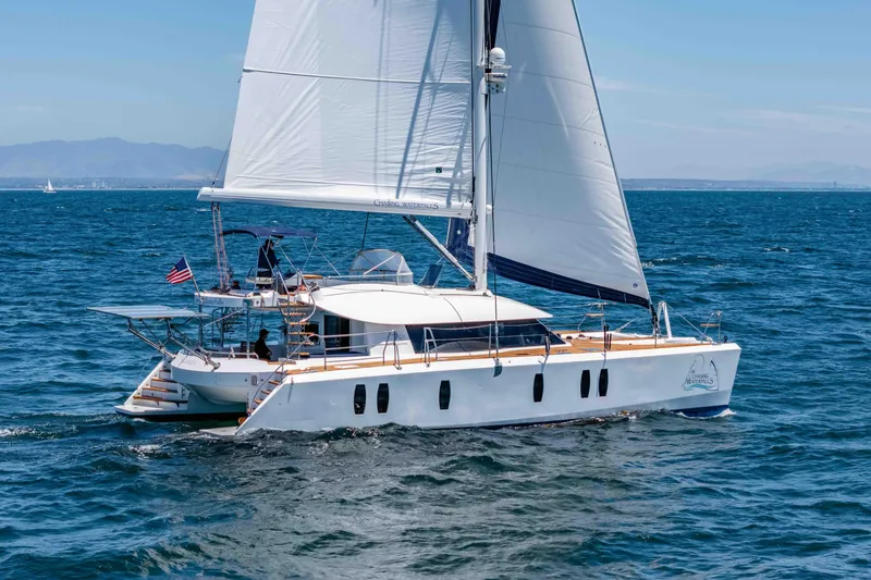 Chasing Waterfalls Yacht Photos Pics Sailing yacht Tayana Isara 50, 2014 model, cruising on open sea with clear skies.