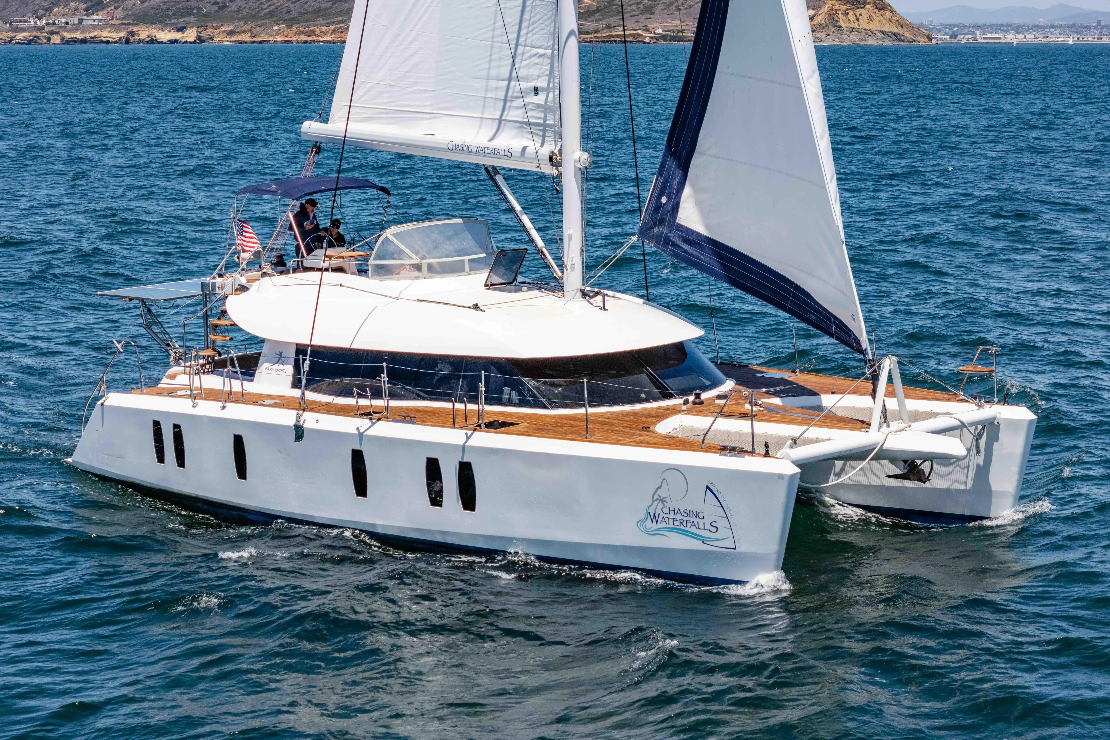 Chasing Waterfalls Yacht Photos Pics Sailing catamaran Tayana Isara 50, 2014 model, cruising on open water.