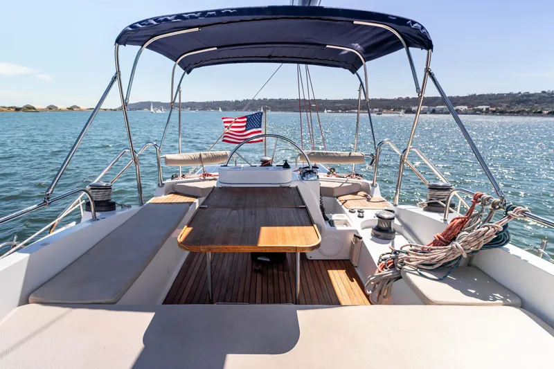 Chasing Waterfalls Yacht Photos Pics Tayana Isara 50 sailboat, 2014 model, with American flag, cruising on a sunny day.