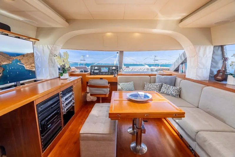 Chasing Waterfalls Yacht Photos Pics Luxurious interior of 2014 Tayana Isara 50 yacht with elegant seating and navigation equipment.