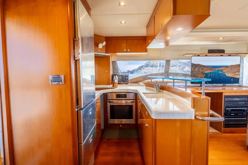 Chasing Waterfalls Yacht Photos Pics Luxurious 2014 Tayana Isara 50 yacht interior with modern kitchen and scenic view.