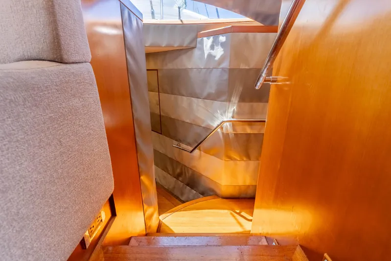 Chasing Waterfalls Yacht Photos Pics Interior view of 2014 Tayana Isara 50 yacht staircase with wooden finish.