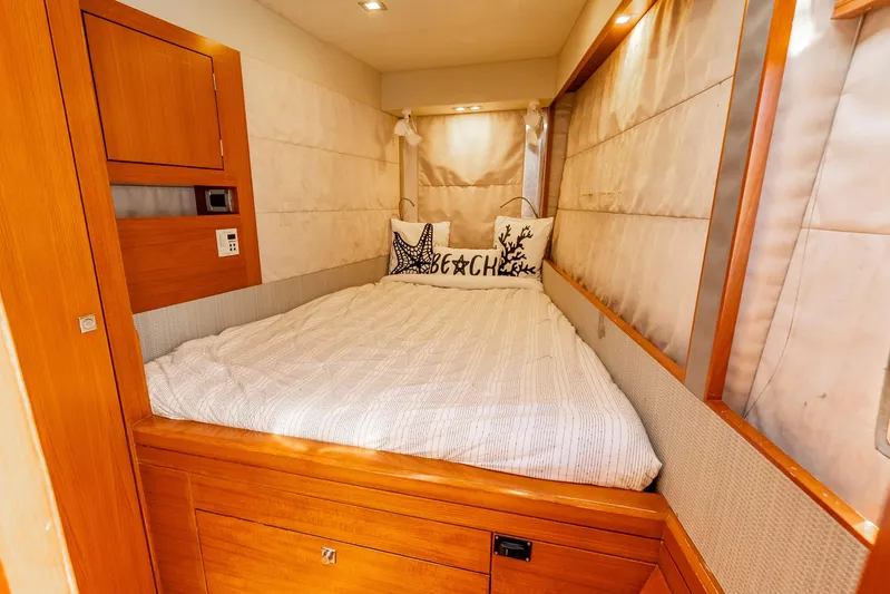 Chasing Waterfalls Yacht Photos Pics Cozy cabin interior of 2014 Tayana Isara 50 yacht with comfortable bedding.