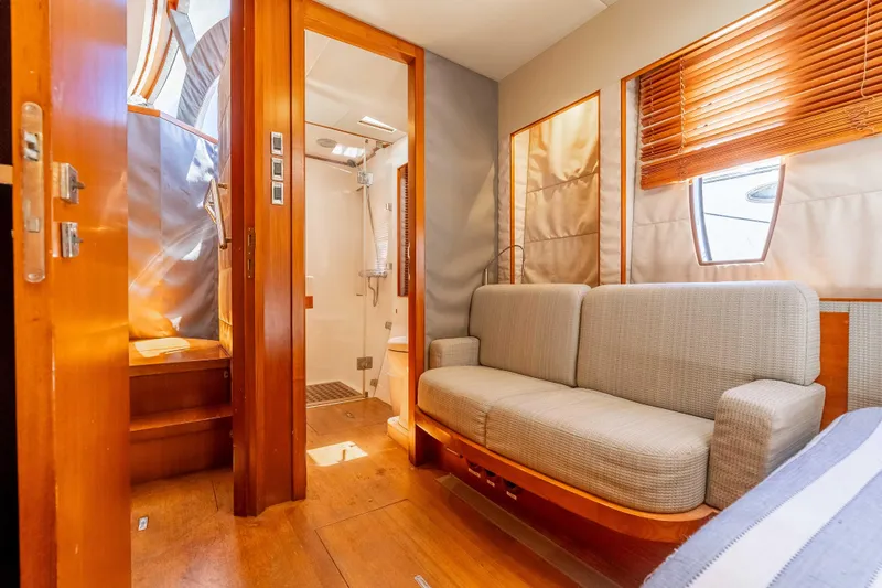 Chasing Waterfalls Yacht Photos Pics Interior of 2014 Tayana Isara 50 yacht featuring cozy seating and a modern bathroom.