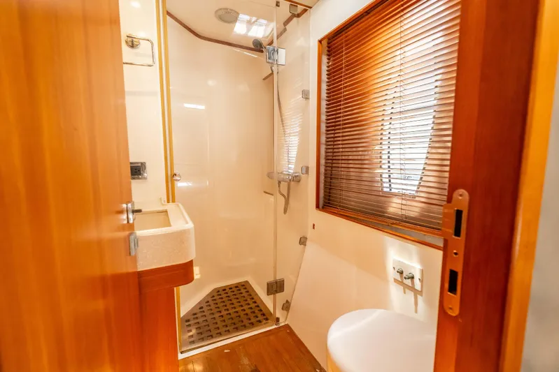 Chasing Waterfalls Yacht Photos Pics Luxurious bathroom in 2014 Tayana Isara 50 yacht with shower and wooden accents.