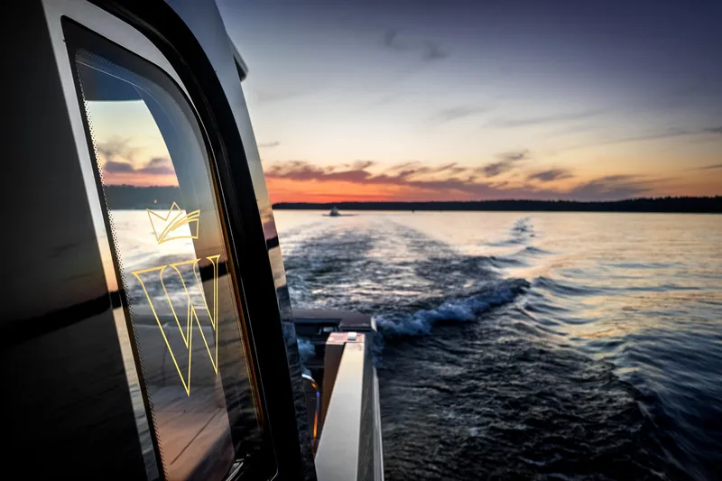  Yacht Photos Pics Wiszniewski Yachts W43, 2025 model, cruising at sunset on serene waters.