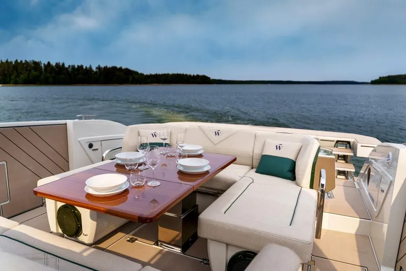  Yacht Photos Pics Luxurious 2025 Wiszniewski Yachts W43 with elegant dining setup on deck.