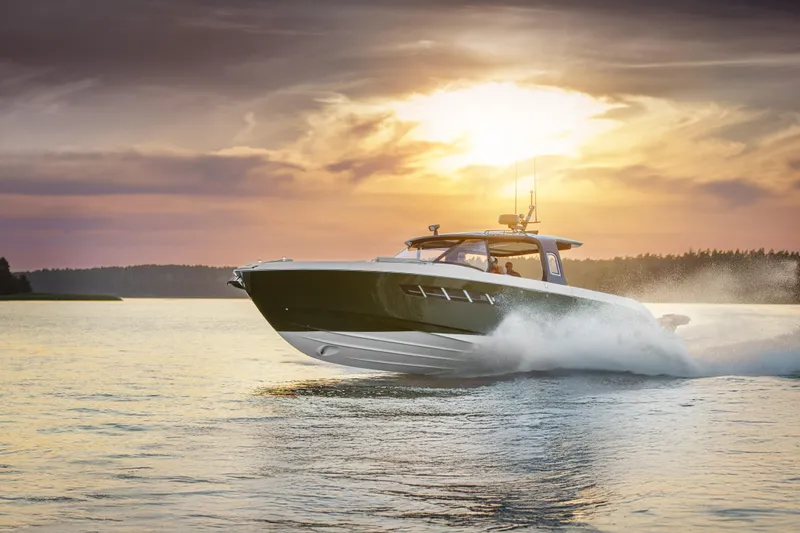  Yacht Photos Pics 2025 Wiszniewski Yachts W43 cruising at sunset on a serene lake.