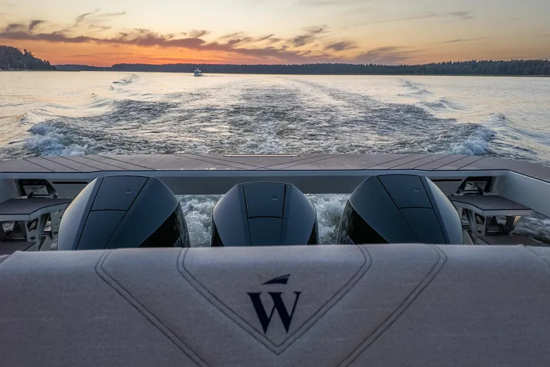  Yacht Photos Pics Sleek Wiszniewski Yachts W43 cruising at sunset, showcasing powerful engines, 2025 model.