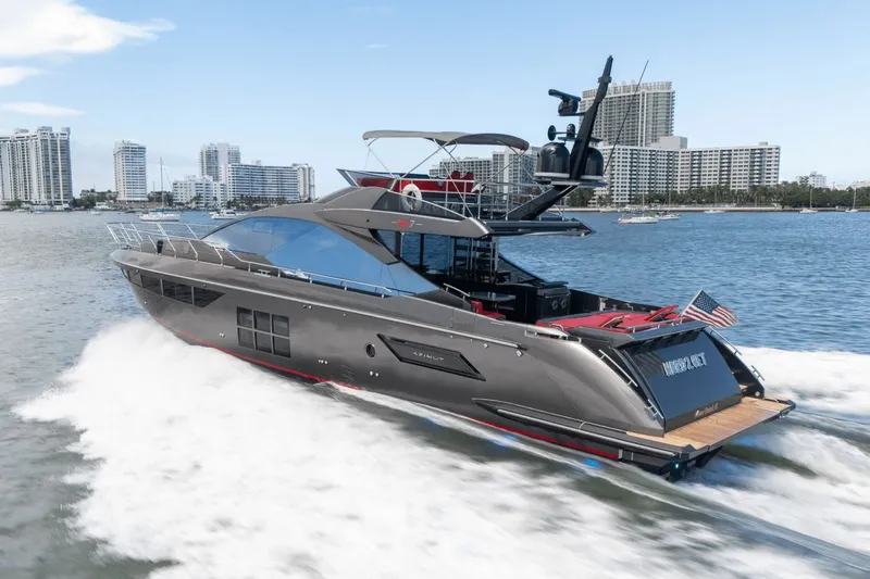 Hard To Get Yacht Photos Pics 2019 Azimut S7 yacht cruising on water with city skyline in background.