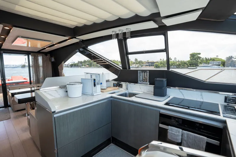Hard To Get Yacht Photos Pics Luxurious interior of 2019 Azimut S7 yacht with modern kitchen and scenic water view.