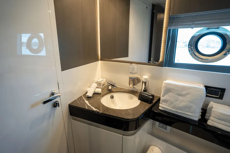 Hard To Get Yacht Photos Pics Luxurious bathroom in 2019 Azimut S7 yacht with modern sink and porthole window.