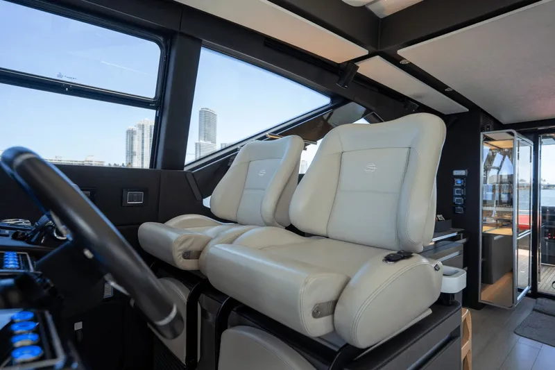 Hard To Get Yacht Photos Pics Interior of 2019 Azimut S7 yacht with luxurious leather seating and modern controls.