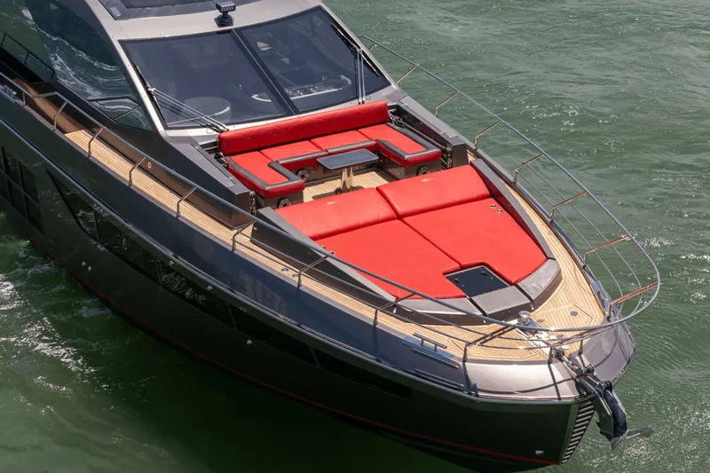 Hard To Get Yacht Photos Pics 2019 Azimut S7 yacht with red sunbathing area on deck, cruising in open water.