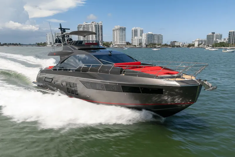 Hard To Get Yacht Photos Pics 2019 Azimut S7 yacht cruising on water with city skyline in background.