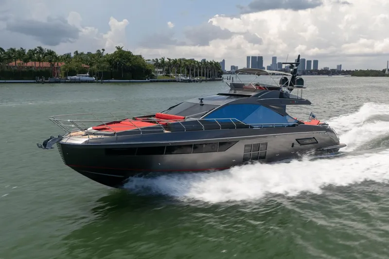 Hard To Get Yacht Photos Pics 2019 Azimut S7 yacht cruising on a scenic waterway with city skyline backdrop.
