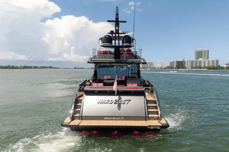 Hard To Get Yacht Photos Pics 2019 Azimut S7 yacht cruising near Miami Beach, Florida, with city skyline in background.