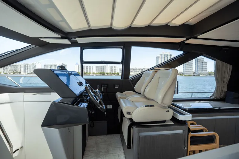 Hard To Get Yacht Photos Pics Luxurious interior of 2019 Azimut S7 yacht with modern helm and leather seating.