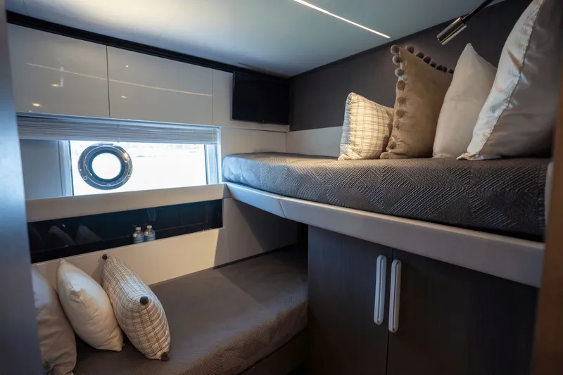Hard To Get Yacht Photos Pics Luxurious cabin interior of 2019 Azimut S7 yacht with bunk beds and porthole window.