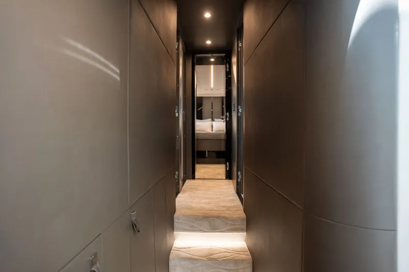 Hard To Get Yacht Photos Pics Luxurious interior hallway of 2019 Azimut S7 yacht, leading to a bedroom.