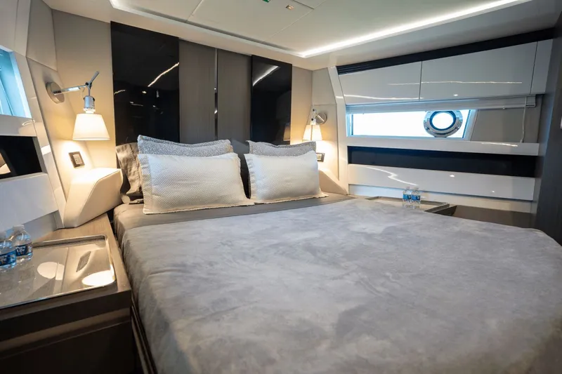 Hard To Get Yacht Photos Pics Luxurious bedroom interior of 2019 Azimut S7 yacht, featuring modern design and elegant furnishings.
