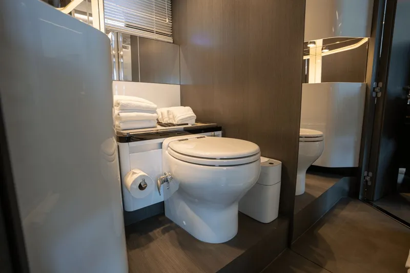 Hard To Get Yacht Photos Pics Luxurious bathroom in 2019 Azimut S7 yacht with modern fixtures and stacked towels.