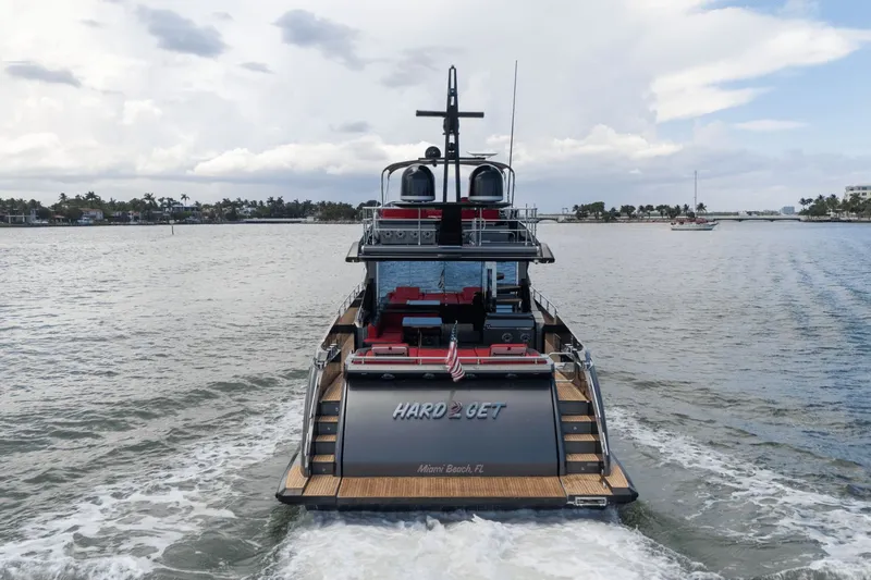 Hard To Get Yacht Photos Pics 2019 Azimut S7 yacht cruising on open water, rear view.
