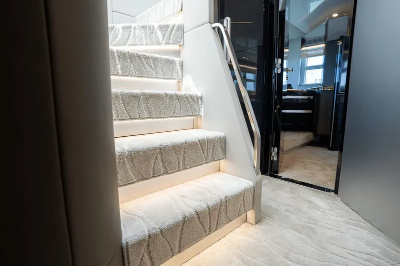 Hard To Get Yacht Photos Pics Luxurious interior staircase of 2019 Azimut S7 yacht with elegant carpeting and modern design.