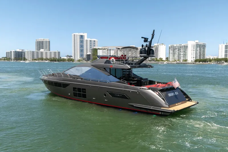 Hard To Get Yacht Photos Pics 2019 Azimut S7 yacht cruising near city skyline on a sunny day.