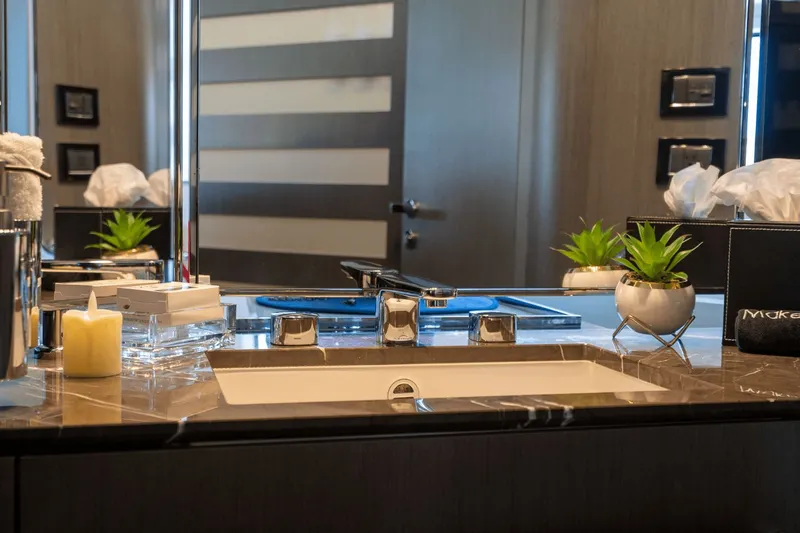 Hard To Get Yacht Photos Pics Luxurious bathroom vanity on 2019 Azimut S7 yacht with modern fixtures and decor.