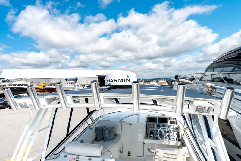  Yacht Photos Pics 2008 Fountain 38 Sportfish Cruiser at marina, featuring Garmin equipment under a blue sky.