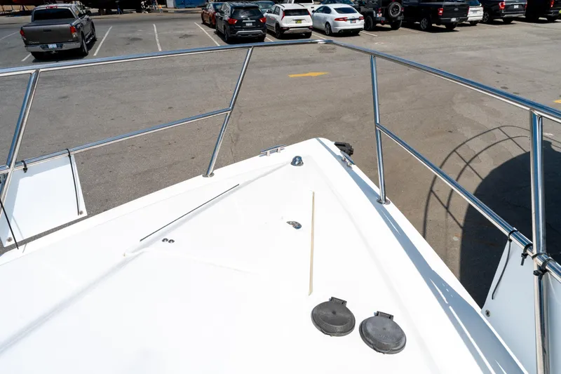  Yacht Photos Pics Bow view of 2008 Fountain 38 Sportfish Cruiser in a parking lot.