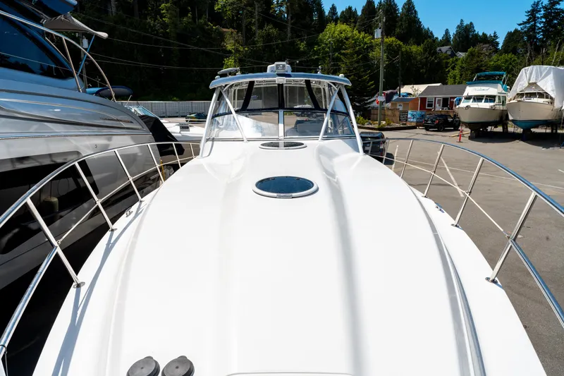  Yacht Photos Pics 2008 Fountain 38 Sportfish Cruiser docked, showcasing sleek design and spacious deck.