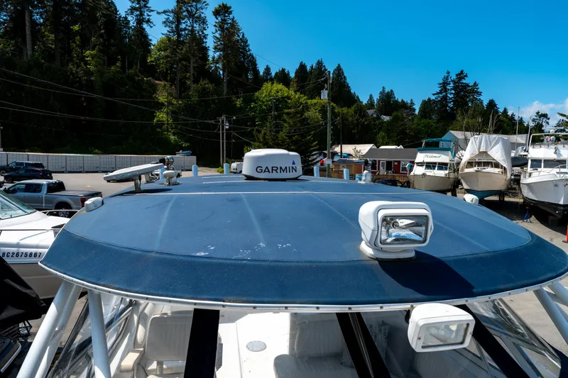  Yacht Photos Pics 2008 Fountain 38 Sportfish Cruiser with Garmin radar, docked at marina under clear blue sky.