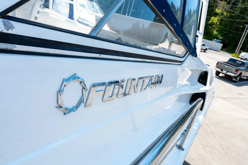  Yacht Photos Pics 2008 Fountain 38 Sportfish Cruiser boat with logo, parked outdoors.