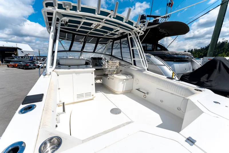  Yacht Photos Pics 2008 Fountain 38 Sportfish Cruiser, spacious deck, marina background, clear sky.