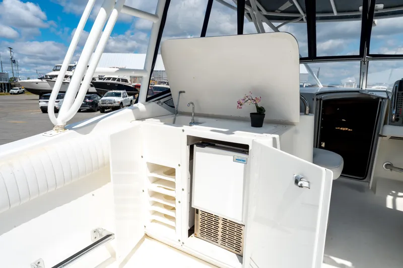  Yacht Photos Pics 2008 Fountain 38 Sportfish Cruiser interior with kitchenette and open storage.