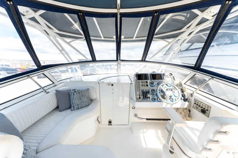  Yacht Photos Pics 2008 Fountain 38 Sportfish Cruiser cockpit with modern controls and seating.